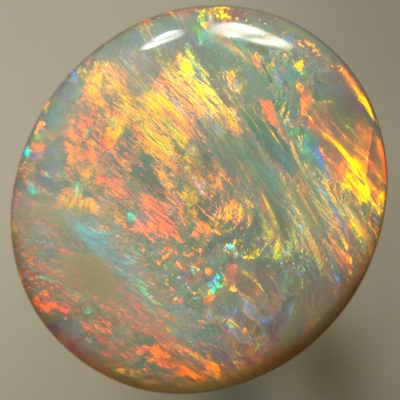 SOLID SEMI BLACK OPAL Bright orange and gold yellow in large rolling flashes. SEE VIDEO